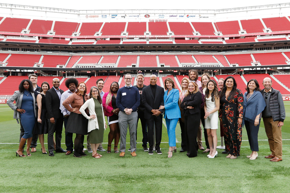 All Stars Helping Kids group photo at stadium